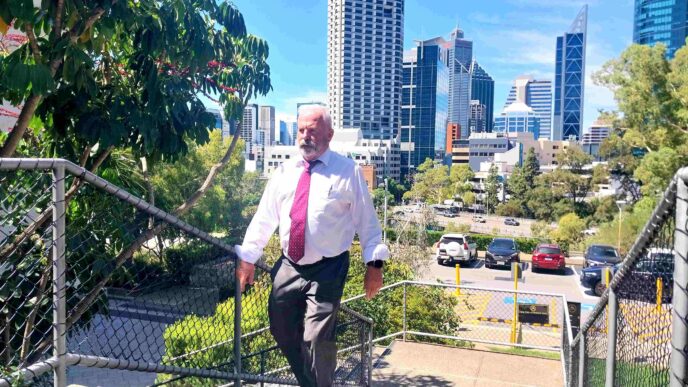 Geof Pary walking up the stairs