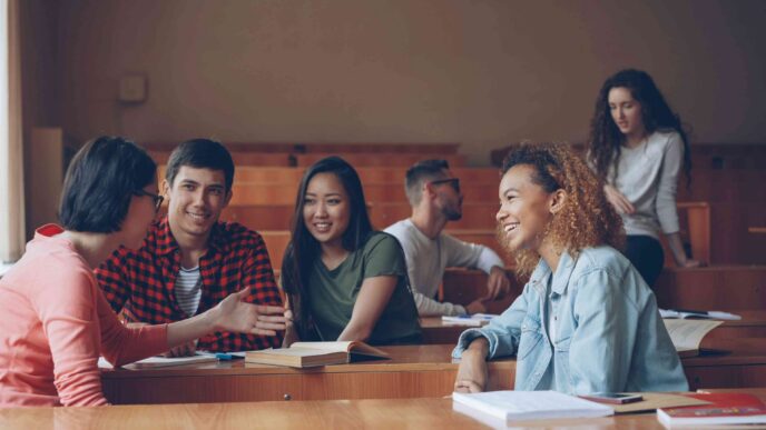 University students socialise with classmates during a break